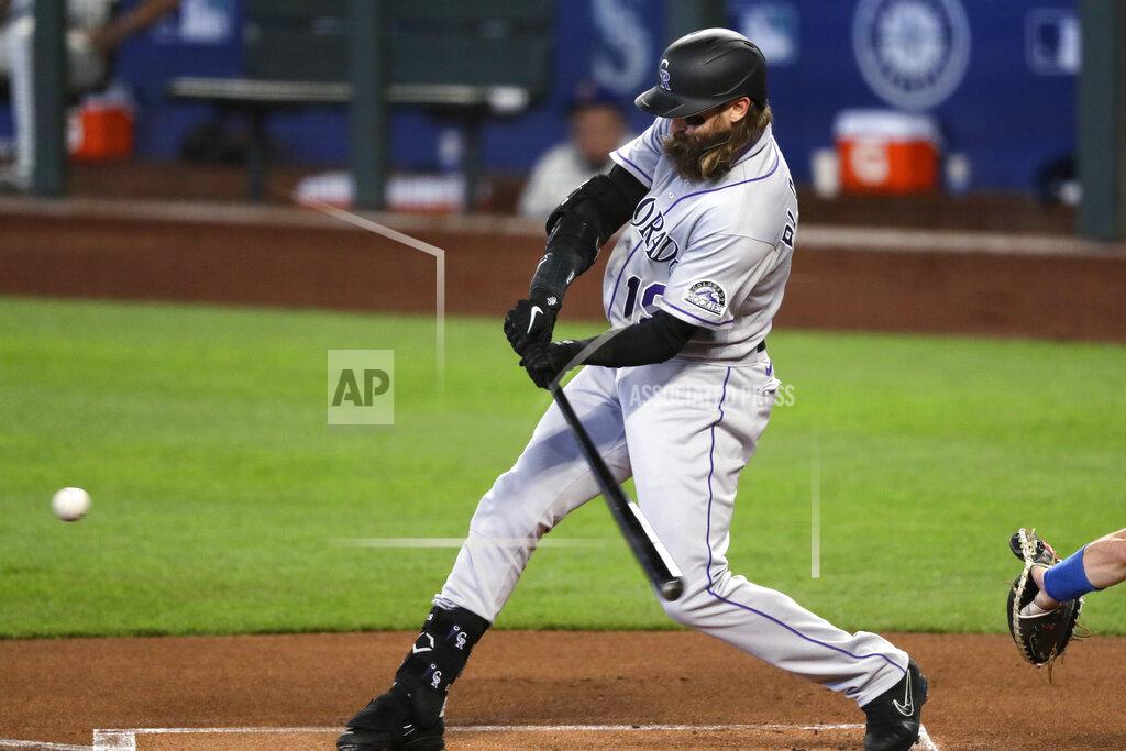 Elaine Thompson Colorado Rockies' Charlie Blackmon doubles against the Seattle Mariners in the first inning of a baseball game Sunday, Aug. 9, 2020, in Seattle. (AP Photo/Elaine Thompson)