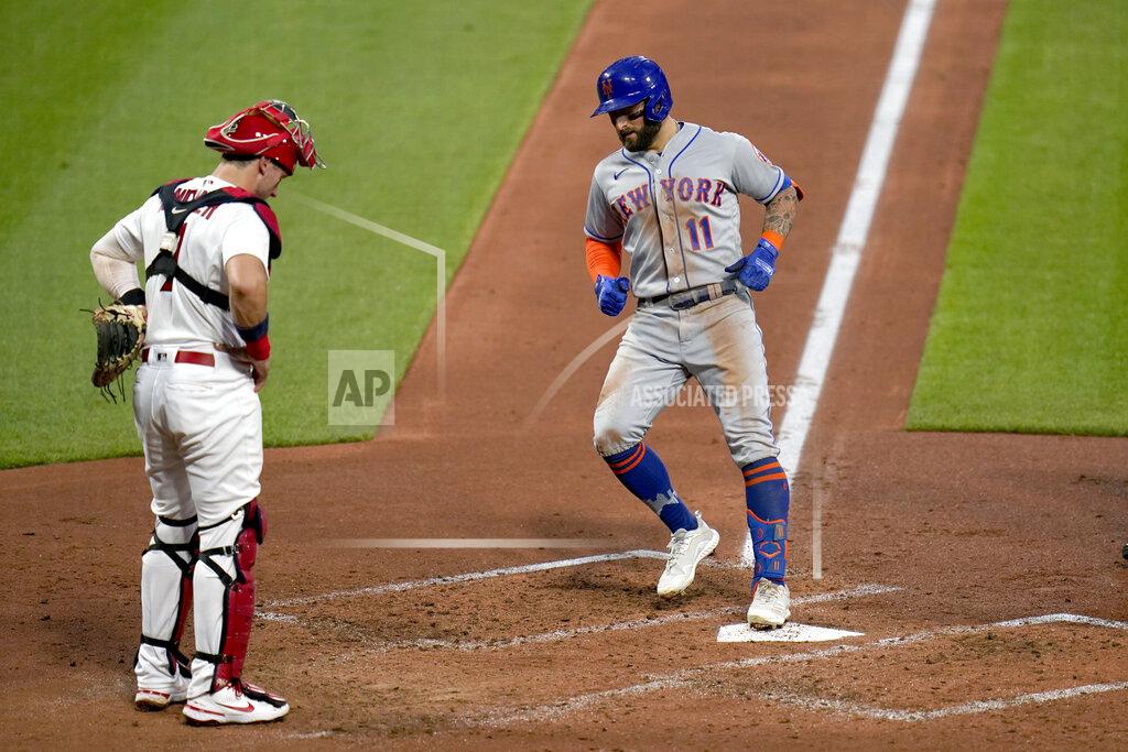 Jeff Roberson New York Mets' Kevin Pillar (11) arrives home after hitting a two-run home run as St. Louis Cardinals catcher Andrew Knizner watches during the third inning of a baseball game Monday, May 3, 2021, in St. Louis. (AP Photo/Jeff Roberson)