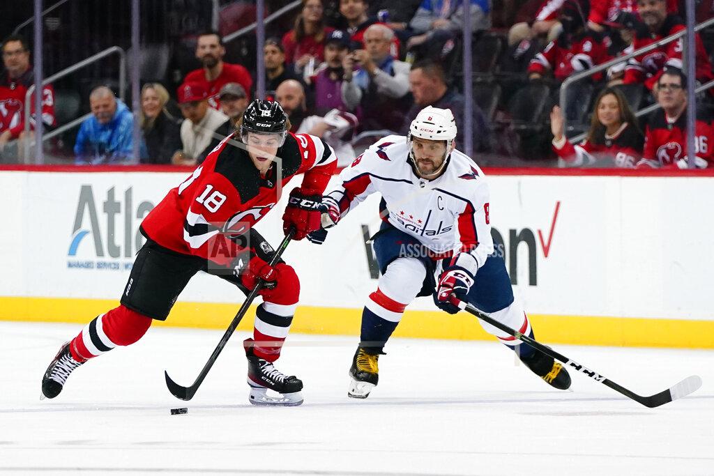 Frank Franklin Ii New Jersey Devils' Dawson Mercer (18) fights for control of the puck with Washington Capitals' Alex Ovechkin (8) during the first period of an NHL hockey game Thursday, Oct. 21, 2021, in Newark, N.J. (AP Photo/Frank Franklin II)