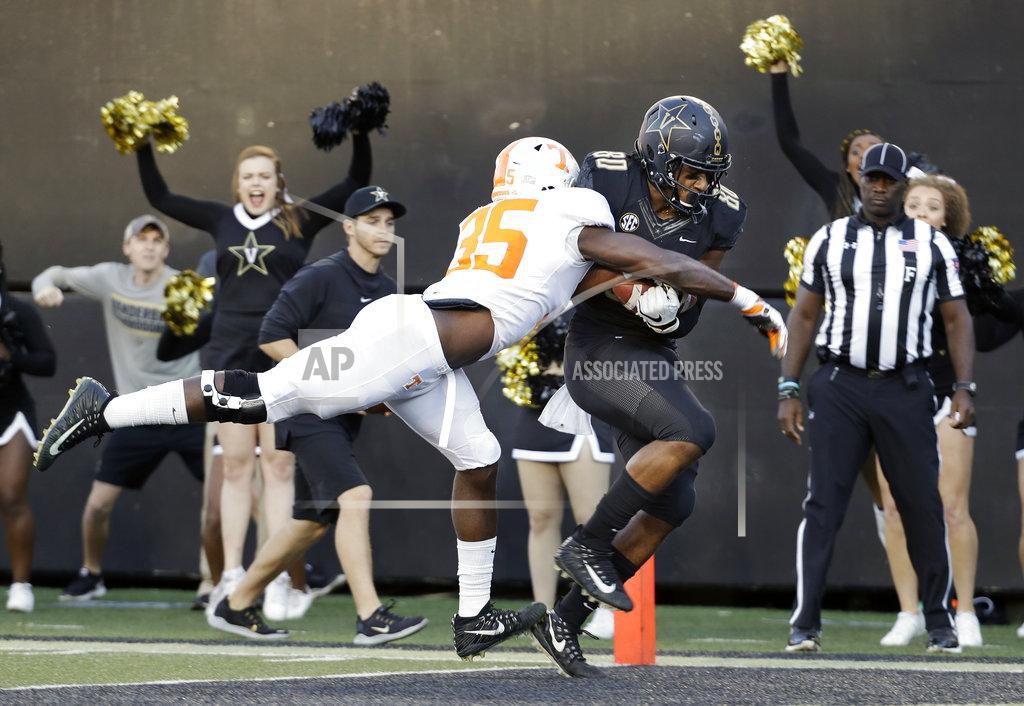 Mark Humphrey Vanderbilt tight end Jared Pinkney (80) scores a touchdown on a 17-yard pass as he is defended by Tennessee linebacker Daniel Bituli (35) in the first half of an NCAA college football game Saturday, Nov. 24, 2018, in Nashville, Tenn. (AP Photo/Mark Humphrey)