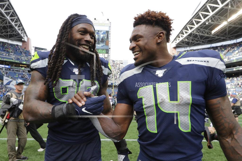 John Froschauer Seattle Seahawks defensive end Jadeveon Clowney, left, talks with teammate DK Metcalf, right, after they defeated the Cincinnati Bengals in an NFL football game Sunday, Sept. 8, 2019, in Seattle. (AP Photo/John Froschauer)