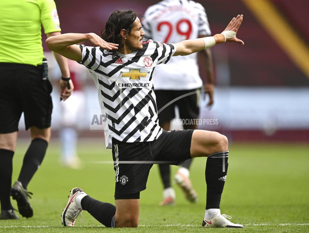 Shaun Botterill Manchester United's Edinson Cavani celebrates after scoring his side's third goal during the English Premier League soccer match between Aston Villa and Manchester United at Villa Park in Birmingham, England, Sunday, May 9, 2021. (Shaun Botterill/Pool via AP)