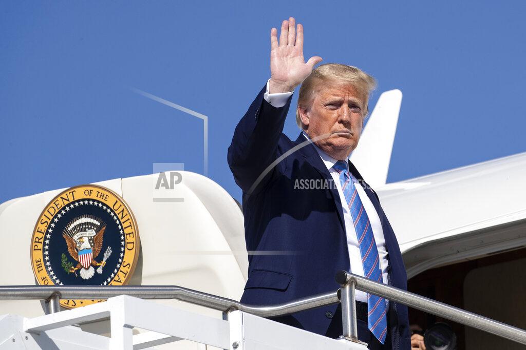 Alex Brandon President Donald Trump waves as he boards Air Force One at Morristown Municipal Airport, Sunday, June 14, 2020, in Morristown, N.J. Trump is returning to Washington. (AP Photo/Alex Brandon)