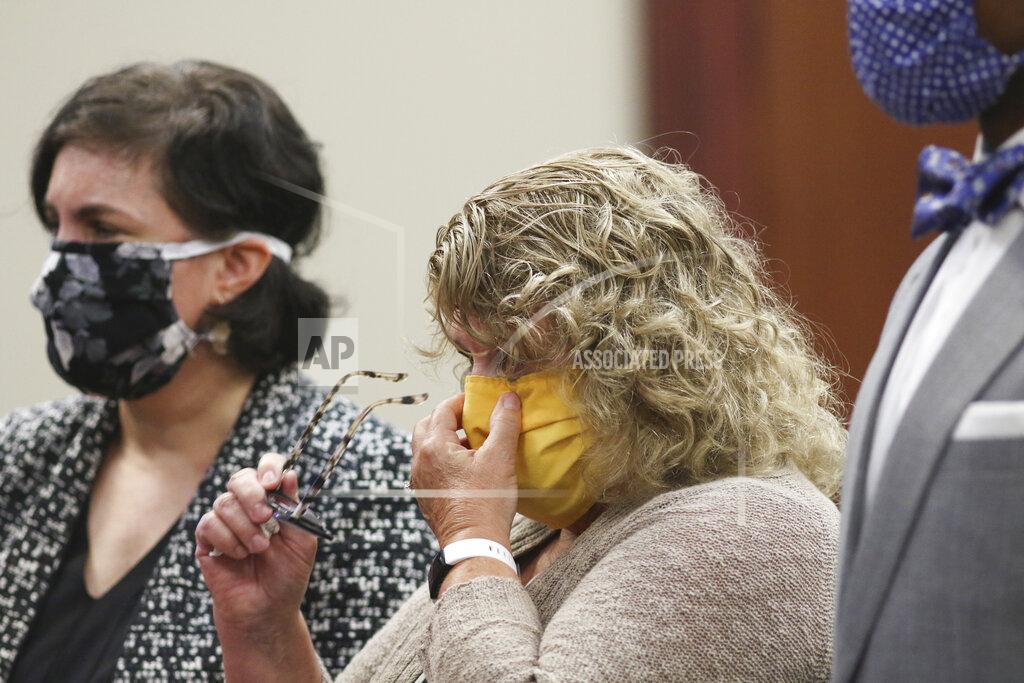 Matthew Dae Smith Flanked by her attorneys Mary Chartier, left, and Takura Nyamfukudza, former Michigan State gymnastics coach Kathie Klages is sentenced in Judge Joyce Draganchuk's courtroom Tuesday, Aug. 4, 2020, in Lansing, Mich. Klages was found guilty of two counts of lying to police related to an interview about her knowledge of Larry Nassar's abuse in 1997. Draganchuk sentenced her to 90 days in jail with credit for one day served. (Matthew Dae Smith/Lansing State Journal via AP)