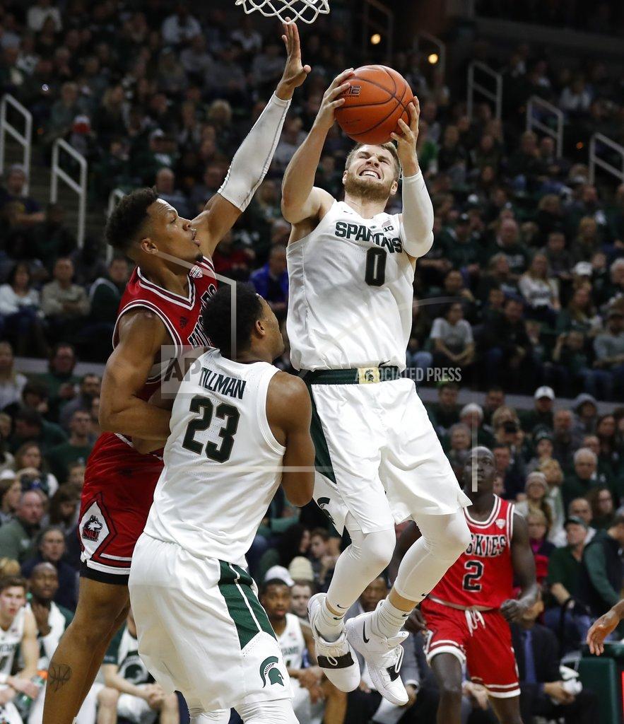 Carlos Osorio Michigan State forward Kyle Ahrens (0) grabs a rebound next to Northern Illinois forward Lacey James during the second half of an NCAA college basketball game, Saturday, Dec. 29, 2018, in East Lansing, Mich. (AP Photo/Carlos Osorio)