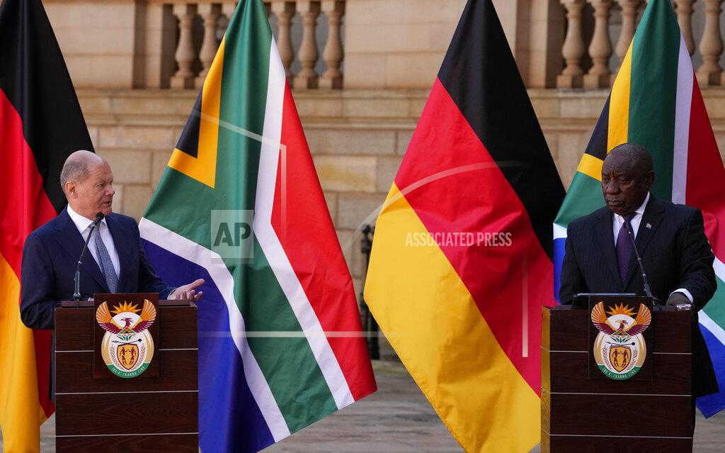 Themba Hadebe German Chancellor Olaf Scholz, left, speaks during a joint press conference with South Africa President Cyril Ramaphosa at the Union Building in Pretoria, South Africa, Tuesday, May 24, 2022. (AP Photo/Themba Hadebe)