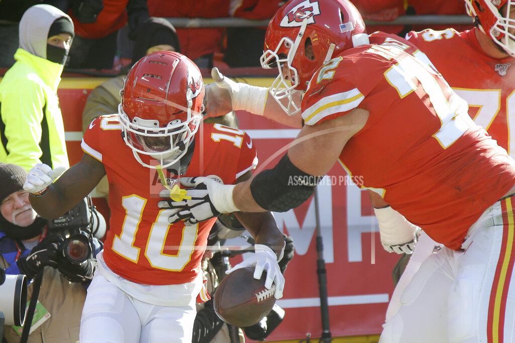 Charlie Riedel Kansas City Chiefs' Tyreek Hill (10) celebrates his touchdown run with offensive tackle Eric Fisher (72) during the first half of the NFL AFC Championship football game against the Tennessee Titans Sunday, Jan. 19, 2020, in Kansas City, MO. (AP Photo/Charlie Riedel)