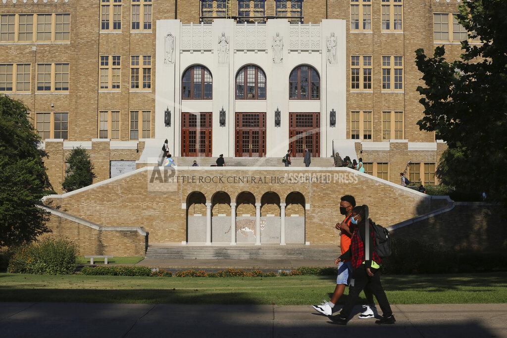 Tommy Metthe Students make their way into Little Rock Central High School on Monday, Aug. 24, 2020, for the first day of classes in the Little Rock School District. (Tommy Metthe /The Arkansas Democrat-Gazette via AP)