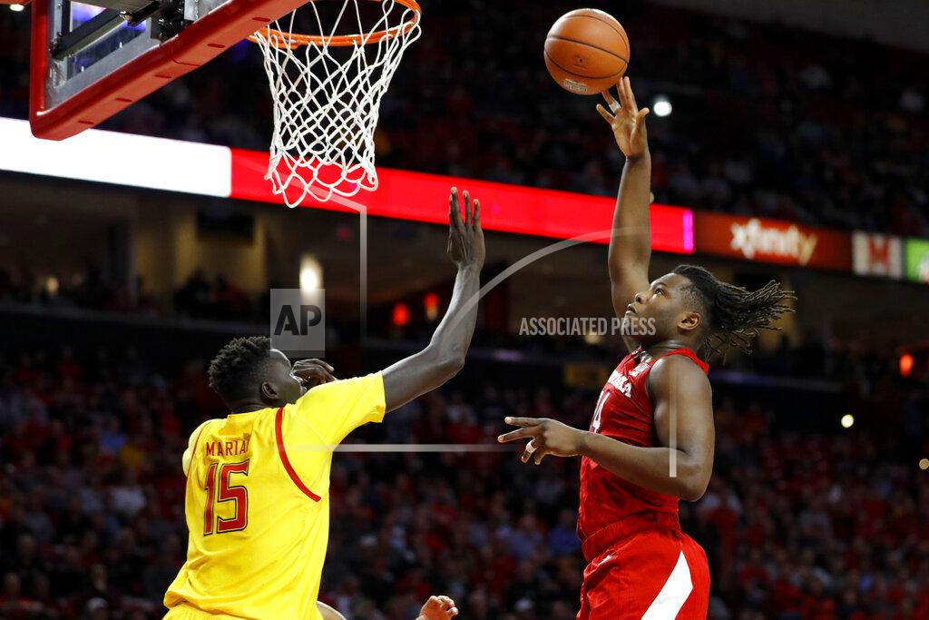 Julio Cortez Nebraska forward Yvan Ouedraogo, right, goes up for a shot against Maryland center Chol Marial (15) during the first half of an NCAA college basketball game, Tuesday, Feb. 11, 2020, in College Park, Md. (AP Photo/Julio Cortez)