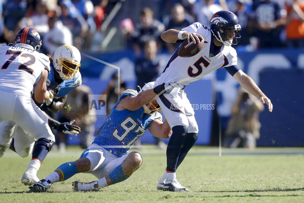 Marcio Jose Sanchez Denver Broncos quarterback Joe Flacco is tackled by Los Angeles Chargers defensive end Joey Bosa during the second half of an NFL football game Sunday, Oct. 6, 2019, in Carson, Calif. (AP Photo/Marcio Jose Sanchez)