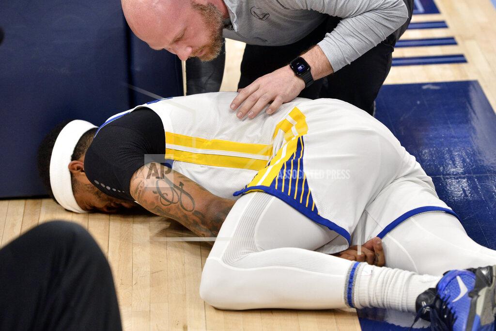 Brandon Dill Golden State Warriors guard Gary Payton II lies on the court after being fouled during the first half of Game 2 of the team's second-round NBA basketball playoff series against the Memphis Grizzlies on Tuesday, May 3, 2022, in Memphis, Tenn. (AP Photo/Brandon Dill)