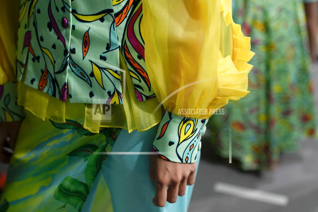 Luca Bruno A model wears a creation of Joy Meribe's Spring Summer 2022 collection in the backstage of the Milan Fashion Week, in Milan, Italy, Wednesday, Sept. 22, 2021. (AP Photo/Luca Bruno)