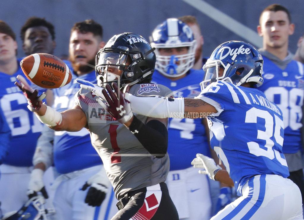 Rogelio V. Solis Temple wide receiver Ventell Bryant (1) bobbles a pass as Duke cornerback Antone Williams (35) closes in during the second half of the Independence Bowl NCAA college football game in Shreveport, La., Thursday, Dec. 27, 2018. Duke won 56-27. (AP Photo/Rogelio V. Solis)
