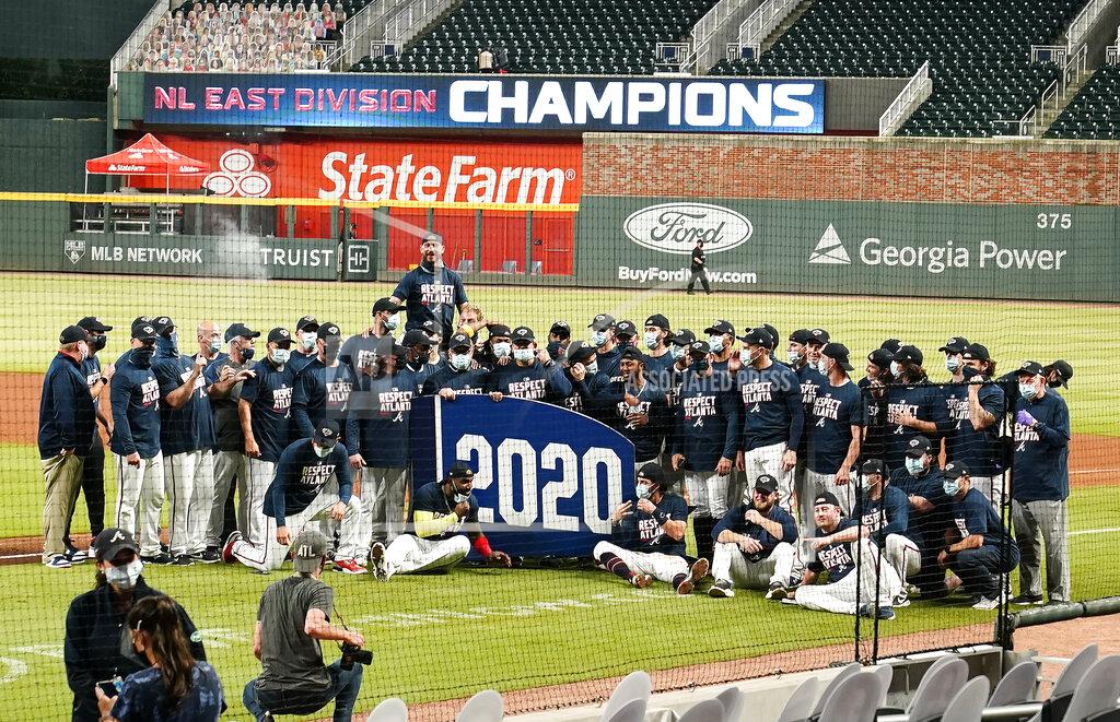 Brynn Anderson The Atlanta Braves celebrate after clinching the NL East baseball title with a win over the Miami Marlins on Tuesday, Sept. 22, 2020, in Atlanta. (AP Photo/Brynn Anderson)
