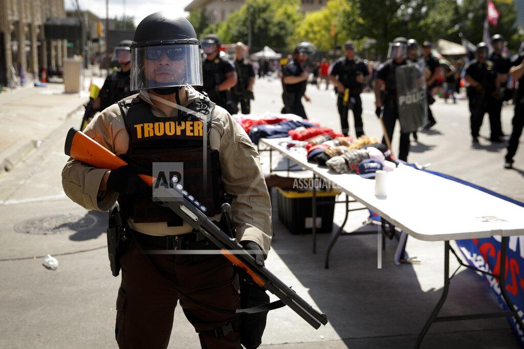 Charlie Riedel A trooper stands outside the BOK Center where President Trump will hold a campaign rally in Tulsa, Okla., Saturday, June 20, 2020. (AP Photo/Charlie Riedel)