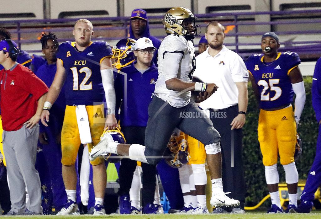 Karl B Deblaker Central Florida's Darriel Mack Jr. (8) runs the ball during the second half of an NCAA college football game against East Carolina, in Greenville, N.C., Saturday, Oct. 20, 2018. UCF won 37-10. (AP Photo/Karl B DeBlaker)