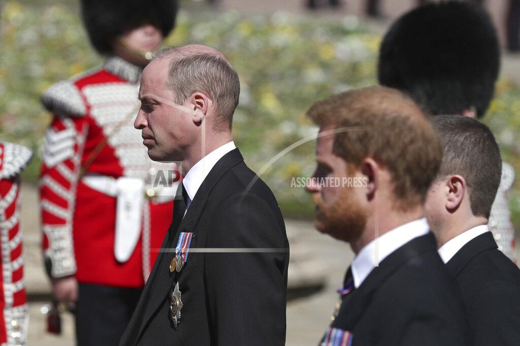 Gareth Fuller Britain's Prince William, left, and Prince Harry follow the coffin as it slowly makes its way in a ceremonial procession during the funeral of Britain's Prince Philip inside Windsor Castle in Windsor, England, Saturday, April 17, 2021. (Gareth Fuller/Pool via AP)