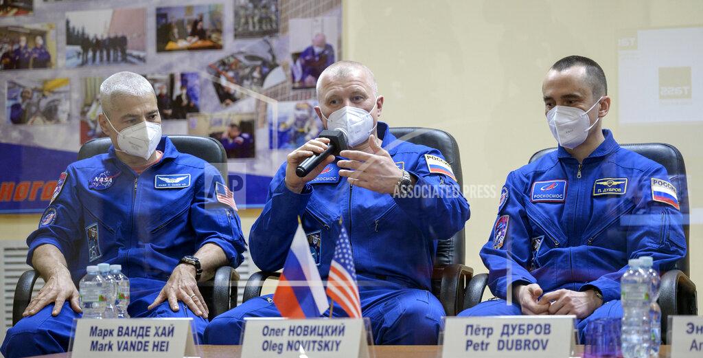 Bill Ingalls In this image provided by NASA, from left, U.S. astronaut Mark Vande Hei, Russian cosmonauts Oleg Novitsky and Pyotr Dubrov, members of the main crew to the International Space Station (ISS), attend a news conference in the Baikonur Cosmodrome, Kazakhstan, Thursday, April 8, 2021. (Bill Ingalls/NASA via AP