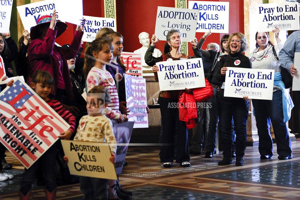 Thom Bridge FILE - In this Feb. 11, 2015, file photo, protesters fill the Capitol rotunda in Helena, Mont., during a rally to show support in an attempt to change the Montana Constitution to define life as beginning at conception. Republican lawmakers in Montana are pushing a series of bills that would limit abortion access and remove gun restrictions, hoping to capitalize on GOP control following the November election. Montana has a Republican governor for the first time in 16 years, opening the door to pass into law bills previously vetoed by Democratic governors. (Thom Bridge/Independent Record via AP, File)