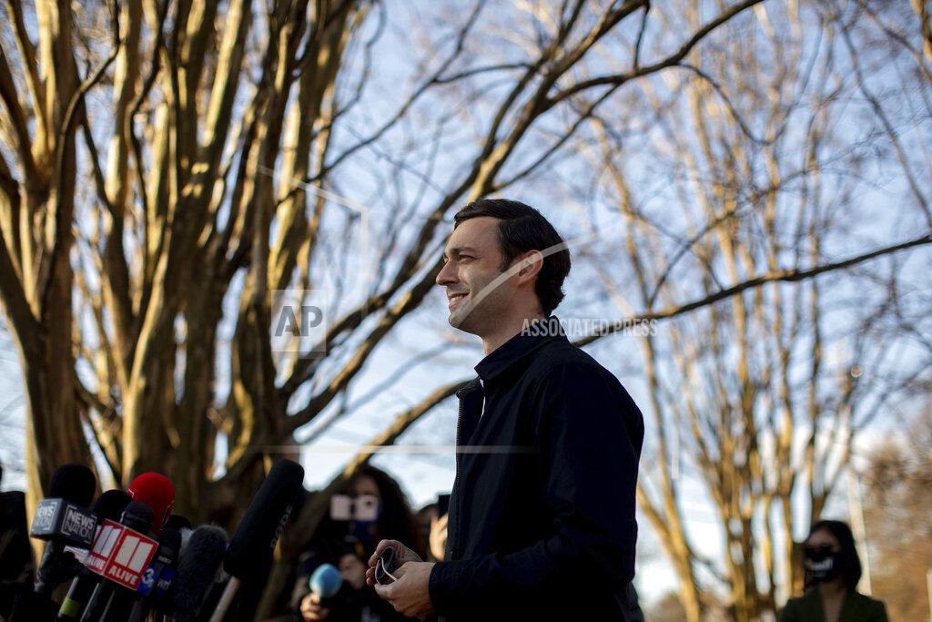 Branden Camp CORRECTS CITY TO ATLANTA Democratic U.S. Senate challenger Jon Ossoff speaks to the media at Dunbar Neighborhood Center during Georgia's Senate runoff elections, Tuesday, Jan. 5, 2021, in Atlanta, Ga. (AP Photo/Branden Camp)