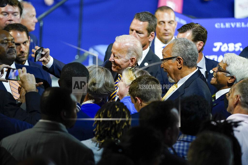 Evan Vucci President Joe Biden takes photos with people after speaking at Max S. Hayes Hight School, Wednesday, July 6, 2022, in Cleveland. (AP Photo/Evan Vucci)
