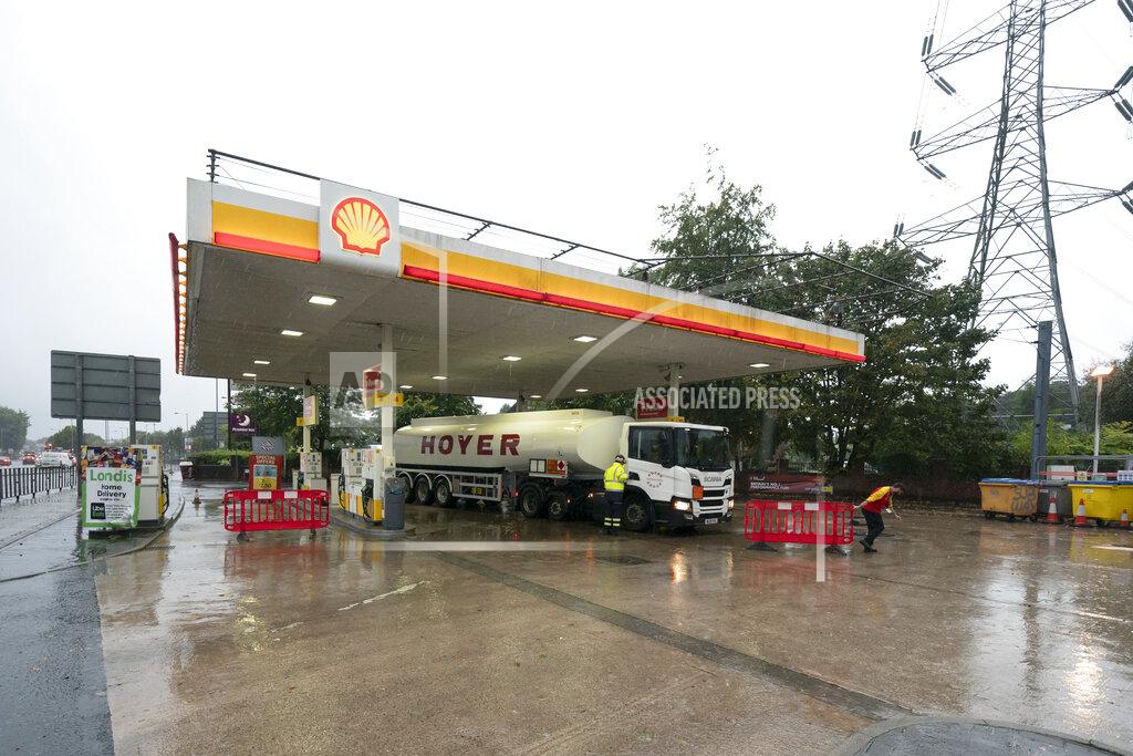 Jon Super A fuel delivery is made to a petrol station in Manchester which had run out of fuel after an outbreak of panic buying in the UK, Monday, Sept. 27, 2021. British Prime Minister Boris Johnson is said to be considering whether to call in the army to deliver fuel to petrol stations as pumps ran dry after days of panic buying. ( AP Photo/Jon Super)