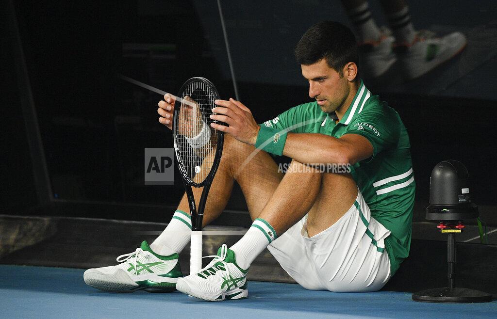 Andy Brownbill Serbia's Novak Djokovic sits down at the back of the court between games during his quarterfinal against Germany's Alexander Zverev at the Australian Open tennis championship in Melbourne, Australia, Tuesday, Feb. 16, 2021.(AP Photo/Andy Brownbill)
