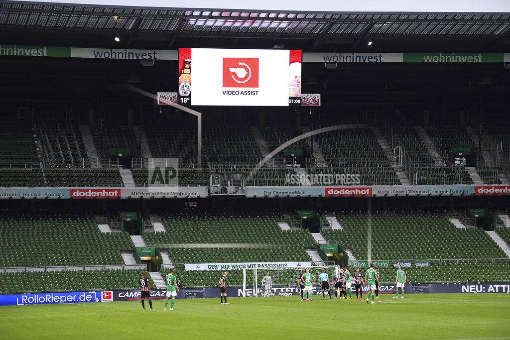 Stuart Franklin FILE - This June 3, 2020, file photo shows empty stands during the German Bundesliga soccer match between SV Werder Bremen and Eintracht Frankfurt in Bremen, Germany. Many professional sports league, such as the NFL and European soccer leagues, have lucrative television contracts and big-money corporate sponsors that fill their substantial coffers. But the domestic soccer league in the U.S. still relies heavily on ticket sales, merchandising and concessions, much like many university athletic departments, and without games their very ability to make ends meet would stretch the abilities of even the savviest of accountants. (Stuart Franklin/Pool via AP, File)