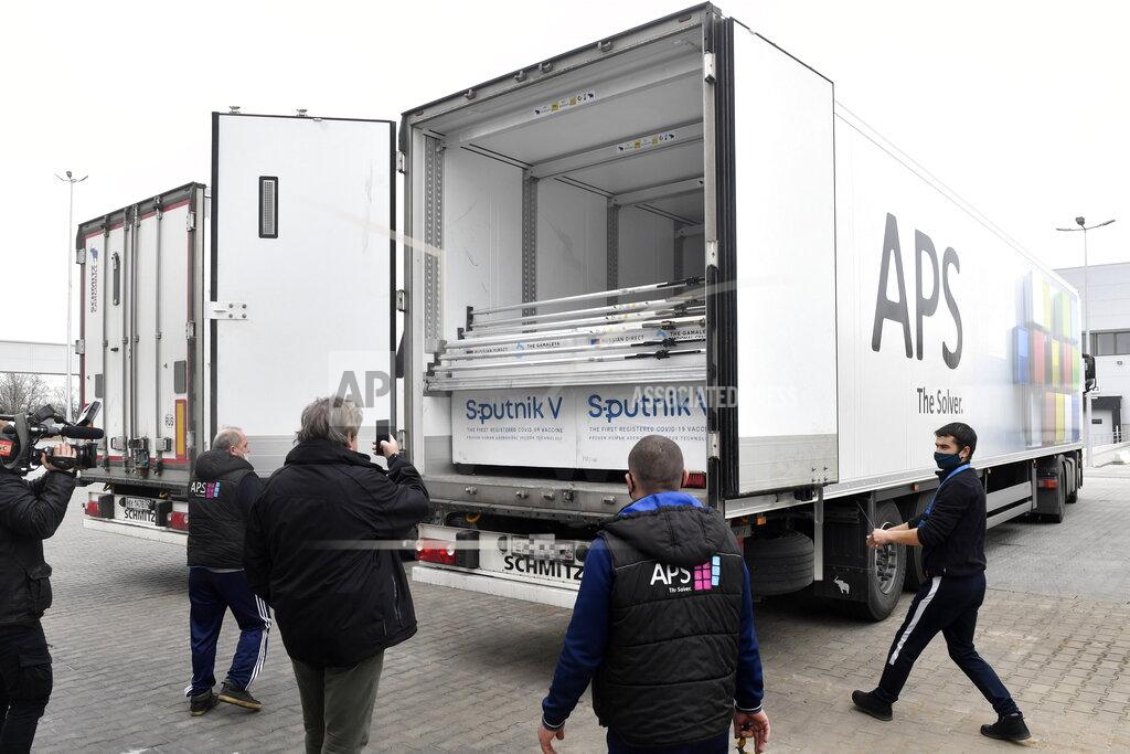 Boxes of Sputnik V vaccines are unloaded from a truck at a warehouse of Hungaropharma, a Hungarian pharmaceutical wholesale company, in Budapest, Hungary, Thursday, March 4, 2021. (Zoltan Mathe/MTI via AP)