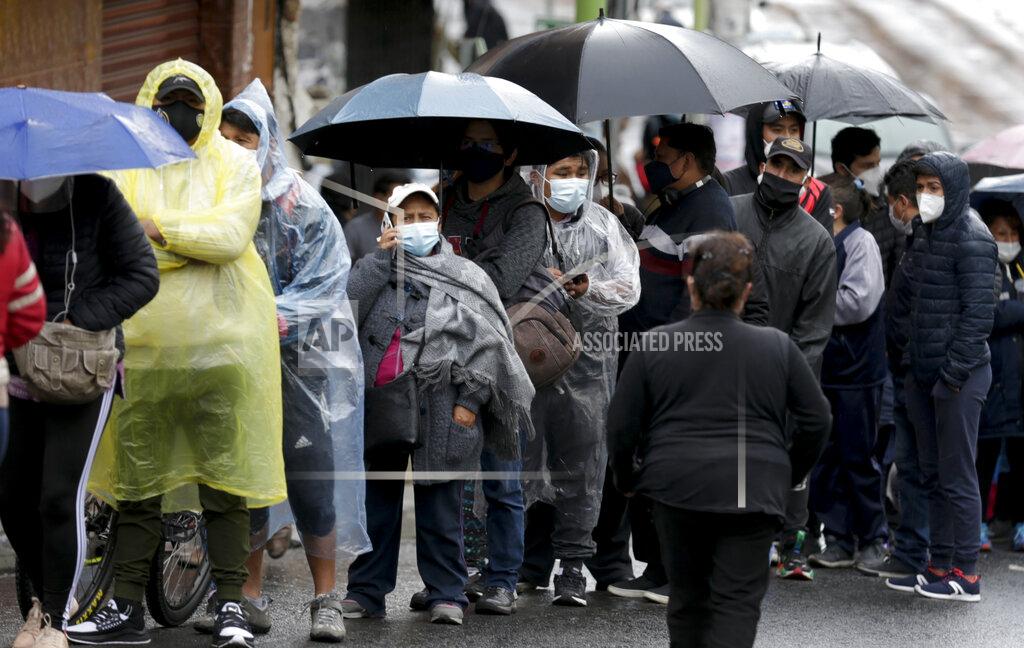 Martin Mejia People line up outside a polling station during general elections in La Paz, Bolivia, Sunday, Oct. 18, 2020. (AP Photo/Martin Mejia)