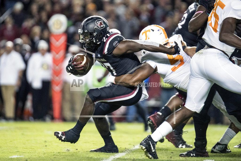 Sean Rayford South Carolina running back Ty'Son Williams (27) is wrapped up by Tennessee defensive lineman Kyle Phillips (5) during the first half of an NCAA college football game Saturday, Oct. 27, 2018, in Columbia, S.C. (AP Photo/Sean Rayford)