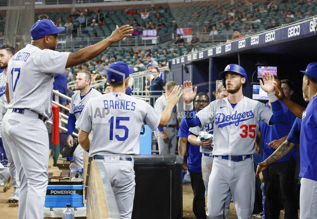 Bob Andres Los Angeles Dodgers' Cody Bellinger celebrates after scoring on a double by Chris Taylor during the eleventh inning of a baseball game against the Atlanta Braves on Sunday, June 26, 2022, in Atlanta. The Dodgers won 5-3. (AP Photo/Bob Andres)