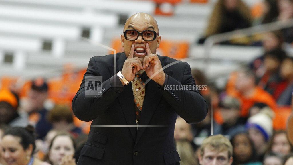 FILE - Syracuse head coach Quentin Hillsman yells to his players in the first quarter of an NCAA college basketball game against Louisville in Syracuse, N.Y., in this Sunday, Feb. 9, 2020, file photo. Syracuse coach Quentin Hillsman has had 11 players enter the NCAA transfer portal and has brought in four players to help make up for the losses. He says the Orange are in a good place and “not in panic mode.” Among those who have departed are leading scorer Kiara Lewis and Emily Engstler, who led the team in rebounding as the first player off the bench. (AP Photo/Nick Lisi, File)
