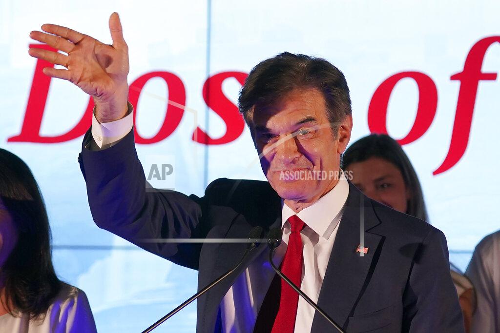 Seth Wenig Mehmet Oz, a Republican candidate for U.S. Senate in Pennsylvania, waves to supporters at a primary night election gathering in Newtown, Pa., Tuesday, May 17, 2022. (AP Photo/Seth Wenig)