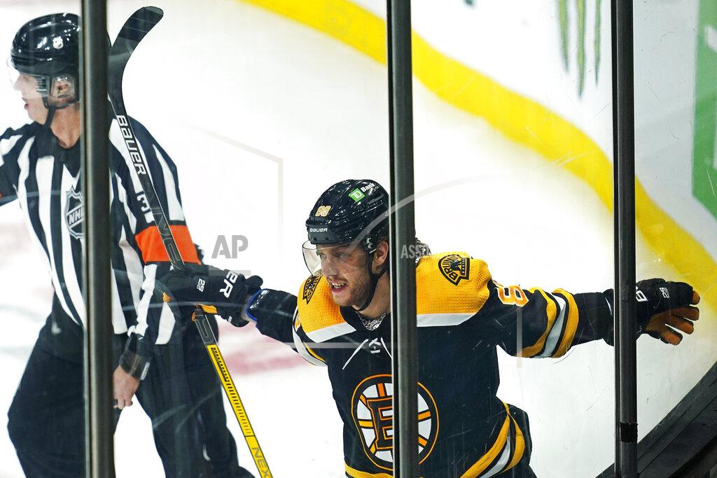 Charles Krupa Boston Bruins right wing David Pastrnak (88) celebrates after his goal against the Washington Capitals during the third period of an NHL hockey game, Wednesday, March 3, 2021, in Boston. (AP Photo/Charles Krupa)