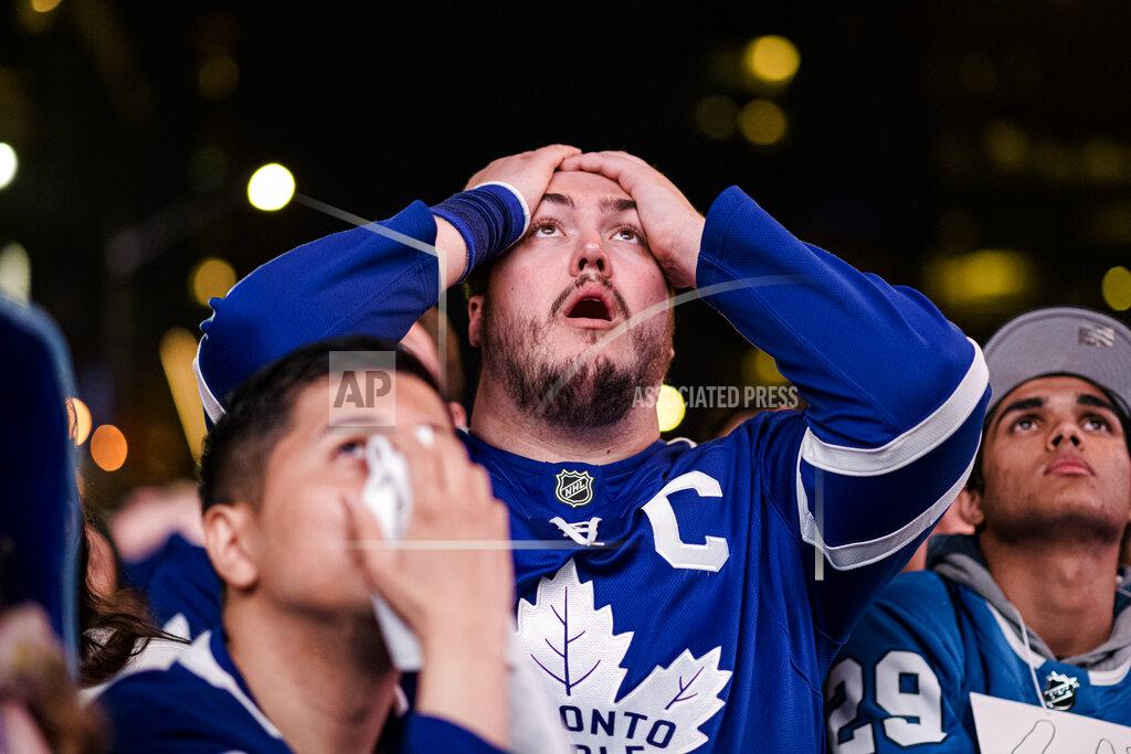 Christopher Katsarov Fans react during Game 7 of an NHL hockey first-round playoff series between the Toronto Maple Leafs and the Tampa Bay Lightning in Toronto, Saturday May 14, 2022. (Christopher Katsarov/The Canadian Press via AP)