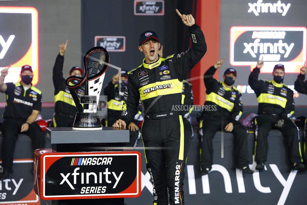Ralph Freso Austin Cindric celebrates in Victory Lane with the season championship trophy after winning the NASCAR Xfinity Series auto race at Phoenix Raceway, Saturday, Nov. 7, 2020, in Avondale, Ariz. (AP Photo/Ralph Freso)