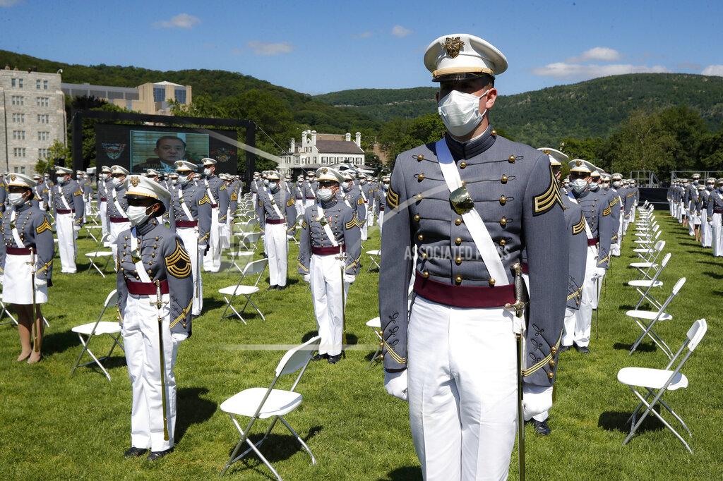 John Minchillo FILE - In this June 13, 2020, file photo, United States Military Academy graduating cadets wear face masks as they stand next to their socially-distanced seats during commencement ceremonies in West Point, N.Y. Most of the 73 West Point cadets accused in the biggest cheating scandal in decades at the U.S. Military Academy are being required to repeat a year, and eight were expelled, academy officials said Friday, April 16, 2021. (AP Photo/John Minchillo, Pool, File)