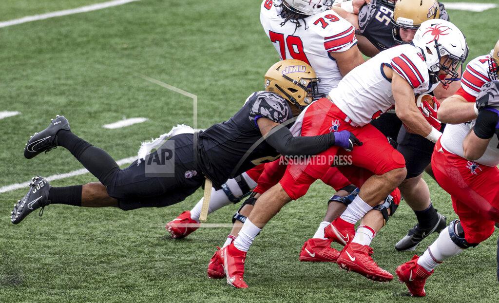Daniel Lin Richmond running back Aaron Dykes (3) gets wrapped up by James Madison linebacker Diamonte Tucker-Dorsey (2) during the first half of an NCAA college football game in Harrisonburg, Va., Saturday, April 17, 2021. (Daniel Lin/Daily News-Record Via AP)