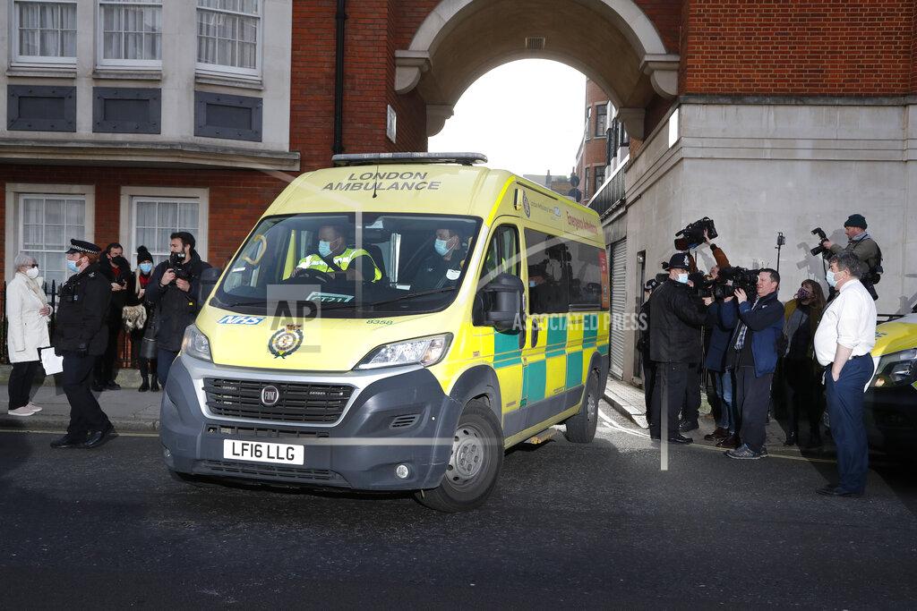 Frank Augstein Police officers stand at an entrance to the King Edward VII Hospital where Prince Philip is being treated for an infection, as an ambulance is driven out, in London, Monday, March 1, 2021. (AP Photo/Frank Augstein)