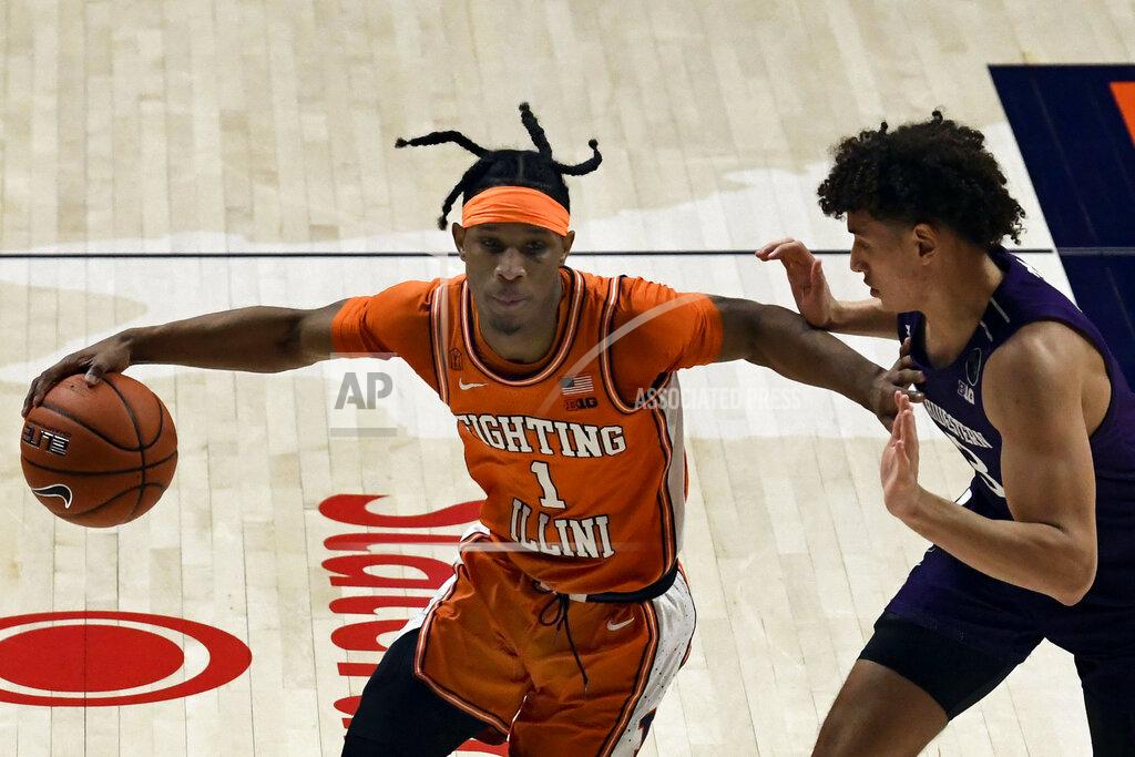 Holly Hart Illinois guard Trent Frazier (1) powers past Northwestern's guard Ty Berry (3) in the first half of an NCAA college basketball game Tuesday, Feb. 16, 2021, in Champaign, Ill. (AP Photo/Holly Hart)
