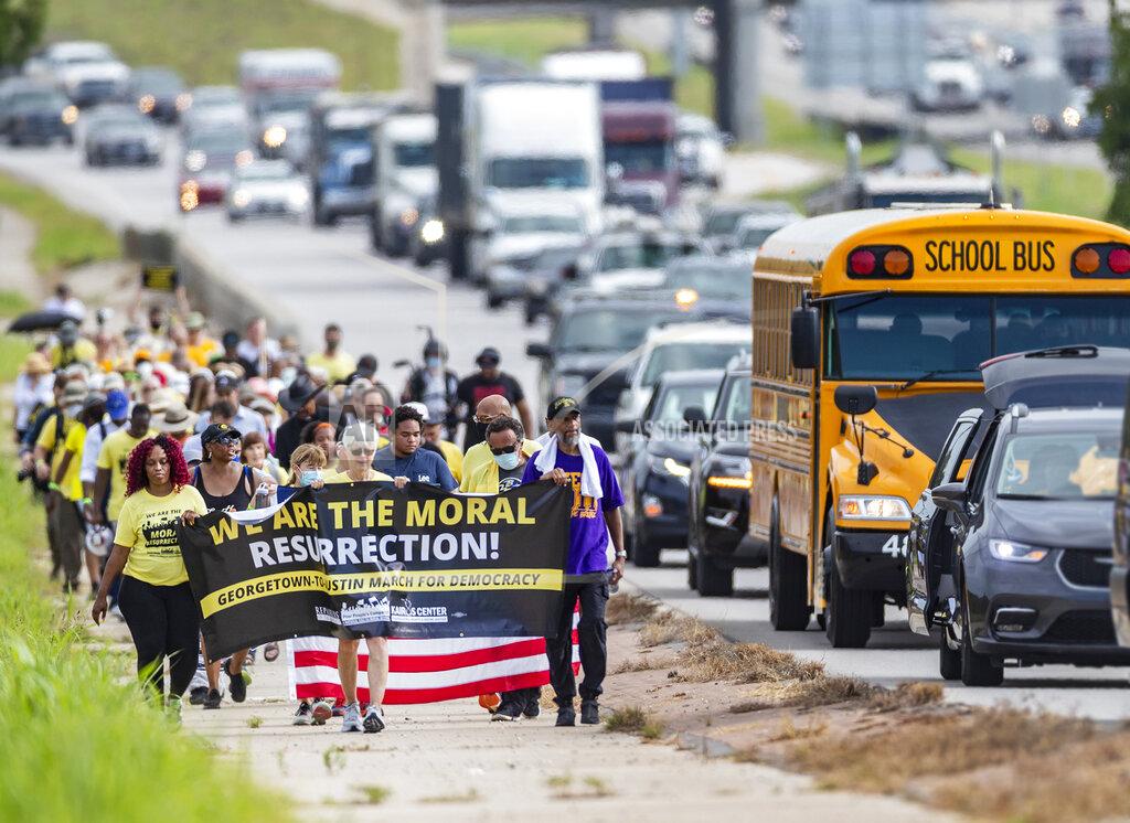 Ricardo B. Brazziell A group of people make a stop at Good Hope Church in Round Rock, Texas, Wednesday, July 28, 2021 during a march from Georgetown, Texas to the Texas State Capitol in downtown Austin. Church leaders and former Democratic congressman Beto O'Rourke are leading the nearly 30-mile voting rights march in Texas. The walk began with nearly 100 participants in suburban Austin and will is scheduled to end this weekend at the state Capitol. The march is the latest effort by Democrats to keep up the pressure over voting rights at a time when the prospects of action from Congress is fading. (Ricardo B. Brazziell/Austin American-Statesman via AP)