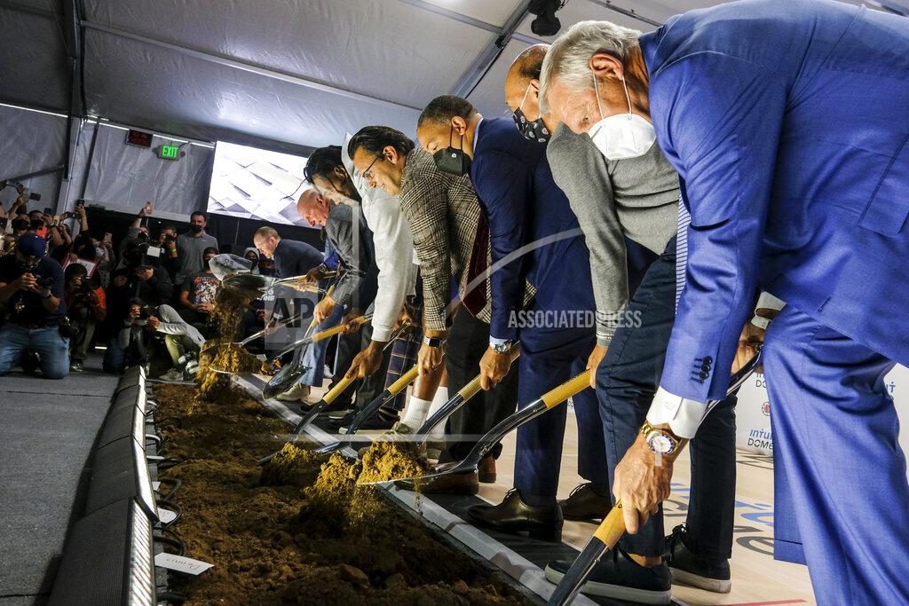 Ringo H.W. Chiu Los Angeles Clippers owner Steve Ballmer along with players Kawhi Leonard and Paul George, head coach Tyronn Lue, Inglewood Mayor James Butts, Jerry West, Gillian Zucker, pose with shovels during a groundbreaking ceremony of the Intuit Dome, Friday, Sept. 17, 2021, in Inglewood, Calif. The Clippers' long-awaited, $1.8 billion, the privately funded arena is officially named Intuit Dome. The practice facility, team offices for both business and basketball operations, retail space, and more will all be on the site when it opens in 2024. (AP Photo/Ringo H.W. Chiu)