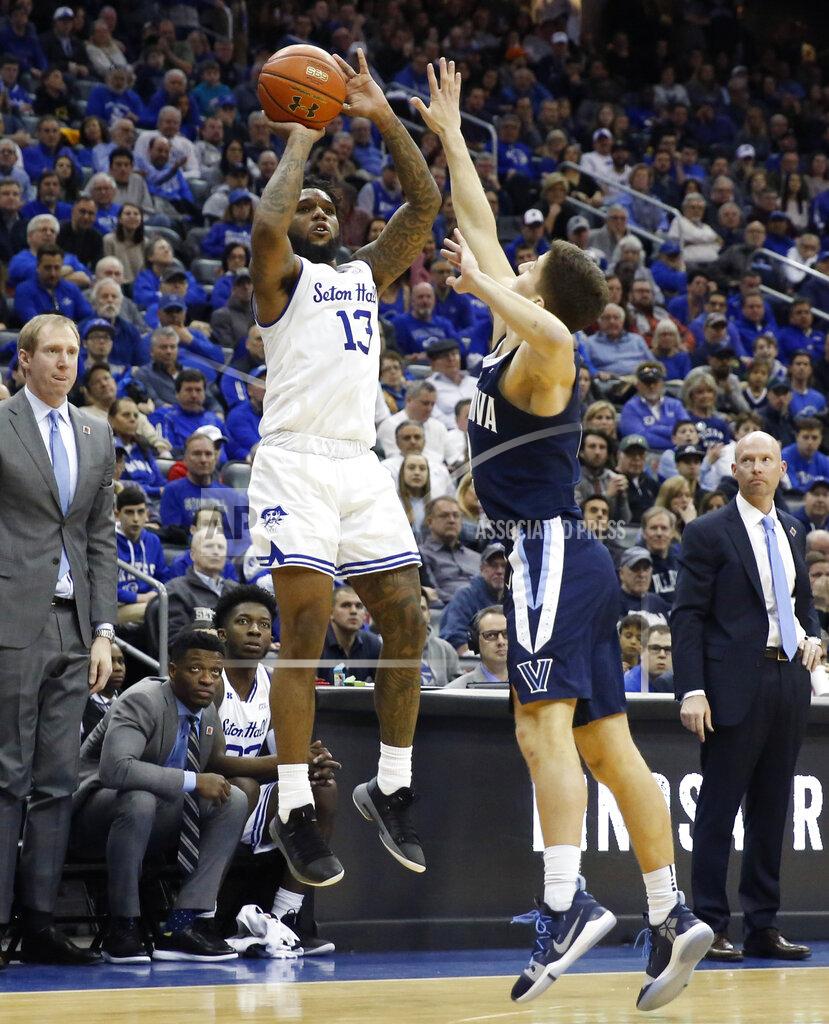 Kathy Willens Villanova guard Collin Gillespie, right, defends as Seton Hall guard Myles Powell (13) shoots a 3-pointer during the second half of an NCAA college basketball game, Saturday, March 9, 2019, in Newark, N.J. Seton Hall defeated Villanova 79-75. (AP Photo/Kathy Willens)