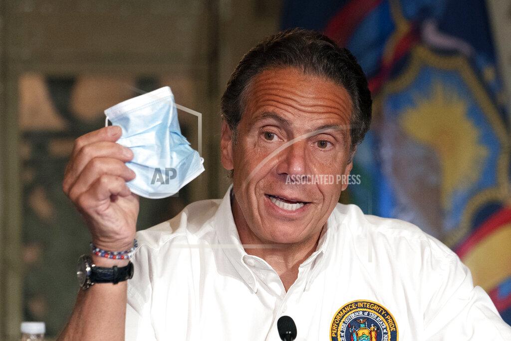 Mark Lennihan FILE — In this May 27, 2021 file photo, New York Gov. Andrew Cuomo discusses the wearing of masks as he speaks at a news conference, in New York. New York Gov. Andrew Cuomo and New York City Mayor Bill de Blasio have scheduled competing news conferences Monday, Aug. 2 amid rising COVID-19 case counts attributed to the highly contagious delta variant of the virus. (AP Photo/Mark Lennihan, Pool, File)