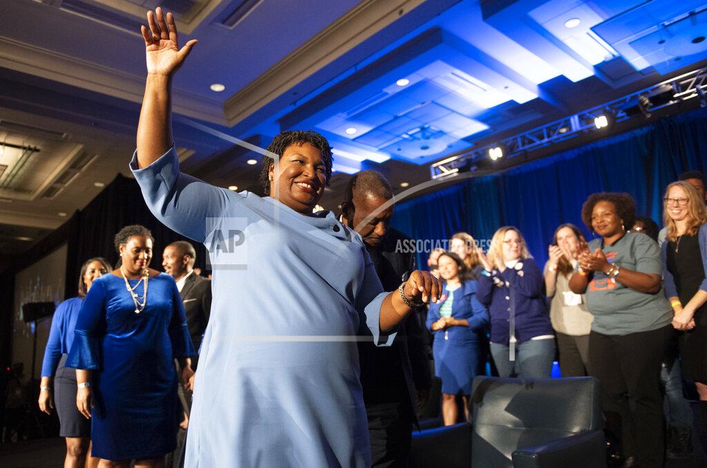 John Amis FILE - In this Tuesday, Nov. 6, 2018 file photo, Georgia Democratic gubernatorial candidate Stacey Abrams leaves the stage after addressing supporters during an election night watch party in Atlanta. She centered her campaign on women of color. In the election, more than 51,000 Black women in Cobb County cast ballots, a number typical for presidential election years but spectacular for midterms, eclipsing the turnout of the 2014 midterm by nearly 20,000 votes. (AP Photo/John Amis)