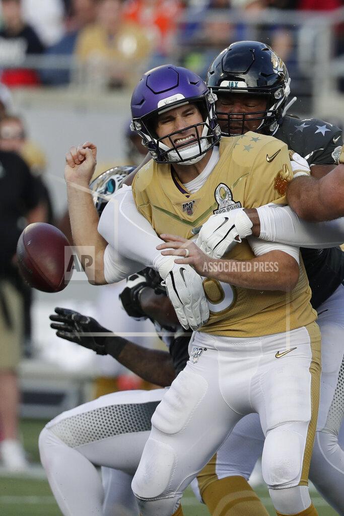 John Raoux AFC defensive end Calais Campbell, of the Jacksonville Jaguars, (93) sacks NFC quarterback Kirk Cousins, of the Minnesota Vikings, and fumbles the ball, during the second half of the NFL Pro Bowl football game, Sunday, Jan. 26, 2020, in Orlando, Fla. (AP Photo/John Raoux)
