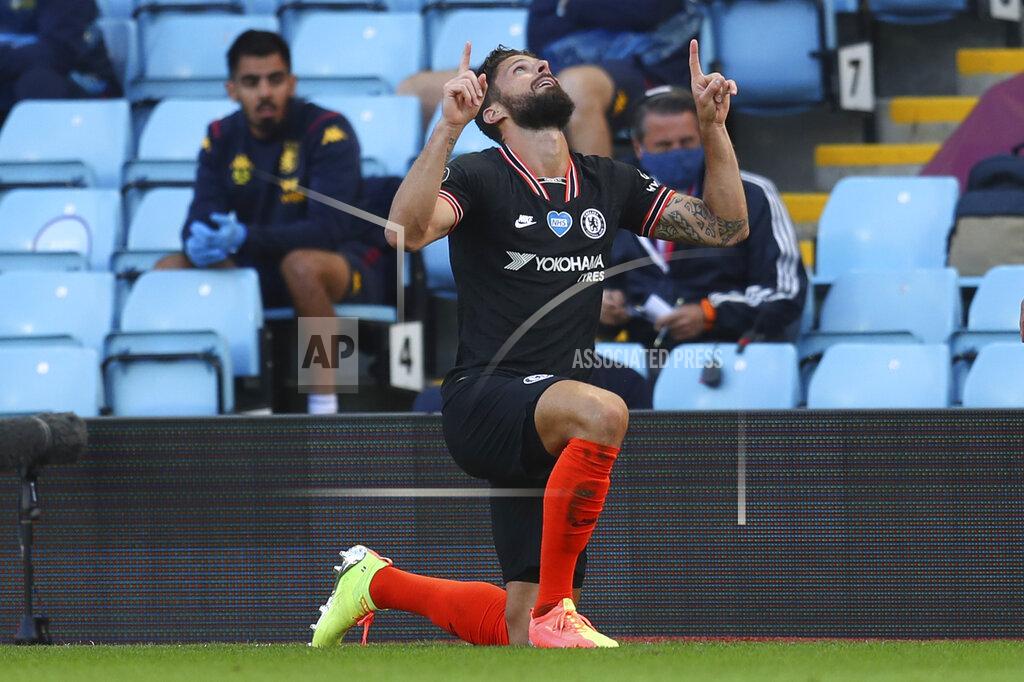 Justin Tallis Chelsea's Olivier Giroud celebrates after scoring his side's second goal during the English Premier League soccer match between Aston Villa and Chelsea at the Villa Park stadium in Birmingham, England, Sunday, June 21, 2020. (Justin Tallis/Pool via AP)