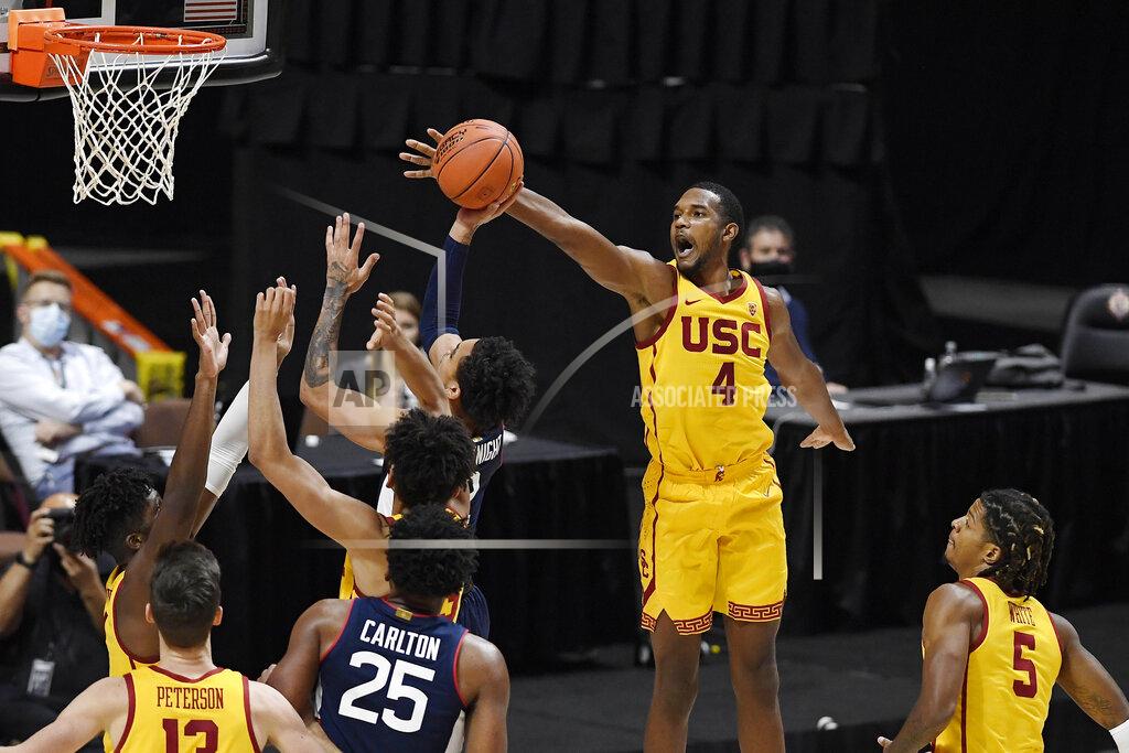 Jessica Hill Southern California's Evan Mobley (4) blocks a shot by Connecticut's James Bouknight during the second half of an NCAA college basketball game Thursday, Dec. 3, 2020, in Uncasville, Conn. (AP Photo/Jessica Hill)