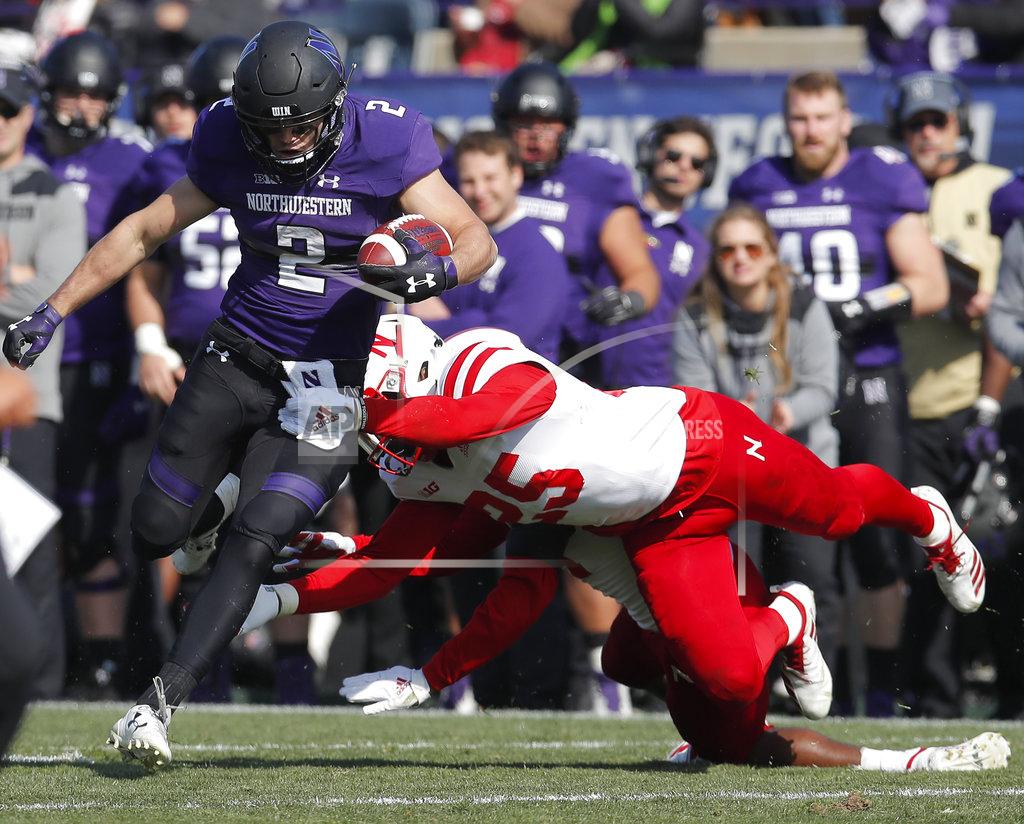 Jim Young Northwestern's Flynn Nagel, left, tries to break a tackle by Nebraska's Antonio Reed during the second half of an NCAA college football game Saturday, Oct. 13, 2018, in Evanston, Ill. (AP Photo/Jim Young)